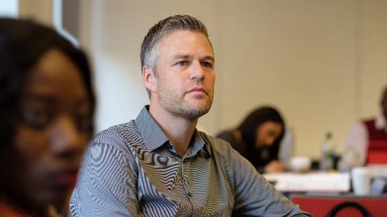 Male executive sitting in class